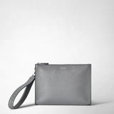Frontal view: CLUTCH IN CACHEMIRE LEATHER AND MOSAICO shows a gray, pebbled leather clutch with an attached wrist handle and subtle metallic branding at the top center.