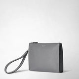 Frontal view: CLUTCH IN CACHEMIRE LEATHER AND MOSAICO shows a sleek gray clutch with a wrist strap resting to the side. Visible text: SERAPIAN.