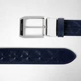Frontal view: BELT IN MOSAICO featuring navy blue woven nappa leather with visible geometric patterns and a polished silver buckle engraved with 'SERAPIAN'.