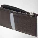 Detail view: ZIP CARD CASE IN MOSAICO shows an open dark brown case with an embossed geometric pattern, an Arctic Blue stripe, and a shiny zipper.