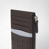 Detail view: ZIP CARD CASE IN MOSAICO shows card slots, a zipped pocket, and graphic ebony and arctic blue details on the front.