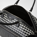 Frontal view of the TRAVEL BAG IN MOSAICO, a spacious travel bag in black-and-white patterned Mosaico Nappa leather featuring an open large main compartment and SERAPIAN MILANO embossing.