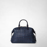 Frontal view: ANI BAG IN MOSAICO shows a structured, medium-sized midnight blue leather handbag with a distinct woven pattern, two top handles, and subtle gold accents.
