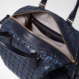 Detail view: ANI BAG IN MOSAICO shows a midnight blue woven leather bag with gold zipper, revealing its beige suede interior and inside zippered pocket labeled 'SERAPIAN MILANO'.