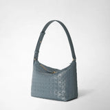 Side view of the SMALL ANI SHOULDER BAG IN MOSAICO in Storm blue, featuring adjustable shoulder strap and embossed Mosaico leather, on neutral background.