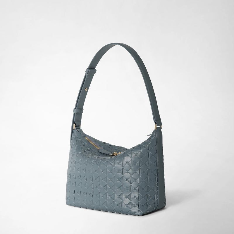 Side view of the SMALL ANI SHOULDER BAG IN MOSAICO in Storm blue, featuring adjustable shoulder strap and embossed Mosaico leather, on neutral background.