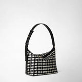 Side view: SMALL ANI SHOULDER BAG IN MOSAICO features a compact shoulder bag with a black and off-white geometric mosaic leather pattern and an adjustable black strap.