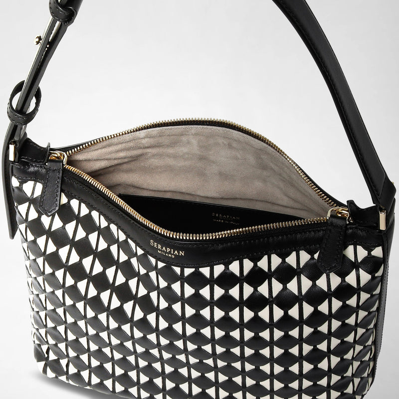 Detail view: SMALL ANI SHOULDER BAG IN MOSAICO shows a black and off-white shoulder bag with a geometric woven leather pattern, gold zipper, and adjustable strap. Interior features soft lining. Visible text: &#39;SERAPIAN MILANO&#39;.