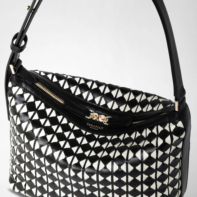Detail view: SMALL ANI SHOULDER BAG IN MOSAICO features a black and off-white woven leather pattern, gold zipper, and &#39;SERAPIAN MILANO&#39; text in gold on the front.