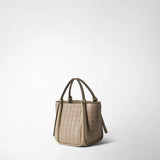 Front view: MINI BUCKET IN MOSAICO is shown against a light background; Sahara-colored Mosaico leather with a geometric woven pattern, soft bucket shape, and long handles with small knots.