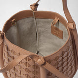 Detail view of MINI BUCKET IN MOSAICO: the sandalwood-colored woven leather bag is open, showing its light lining, leather handles, and a brand label reading “SERAPIAN MILANO MADE IN ITALY”.