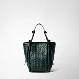 BUCKET IN RIBBON MOSAICO, front view: The dark green bucket bag with an intricately woven, three-dimensional leather texture and long handles stands against a light background.