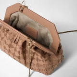 Detail view: The MINI SECRET CLUTCH BAG IN MOSAICO is open, showing its light suede lining, sandalwood-colored Mosaico weave, and gold-tone chain; leather label: “SERAPIAN MILANO MADE IN ITALY”.