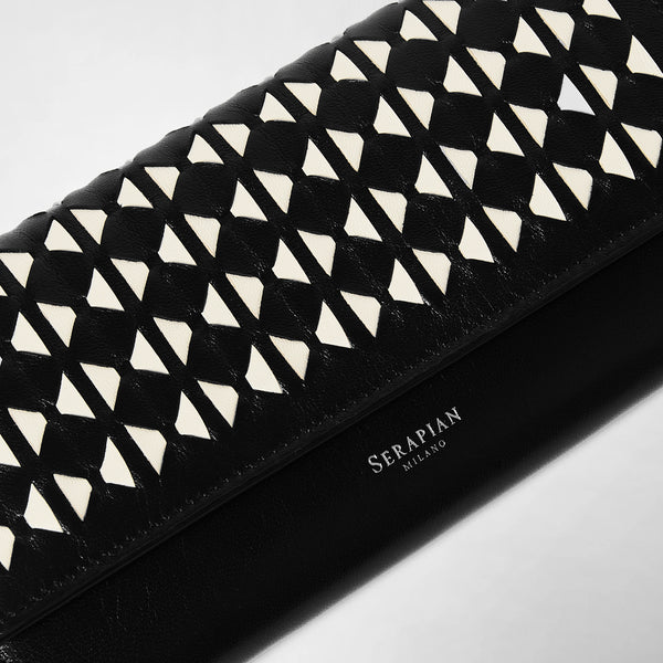 Frontal view: CONTINENTAL WALLET IN MOSAICO in black and off-white woven nappa leather displays a striking geometric Mosaico pattern, featuring white Serapian Milano embossing.