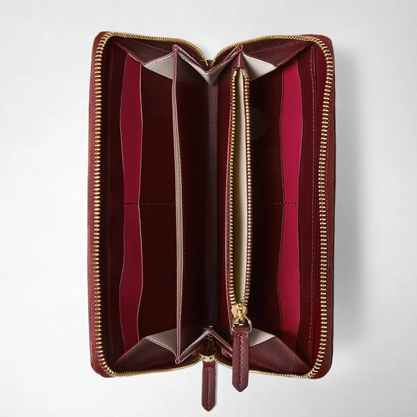 Front view of ZIP-AROUND WALLET IN MOSAICO, open, showing rose-colored leather lining, multiple card slots, and an inner zippered compartment.