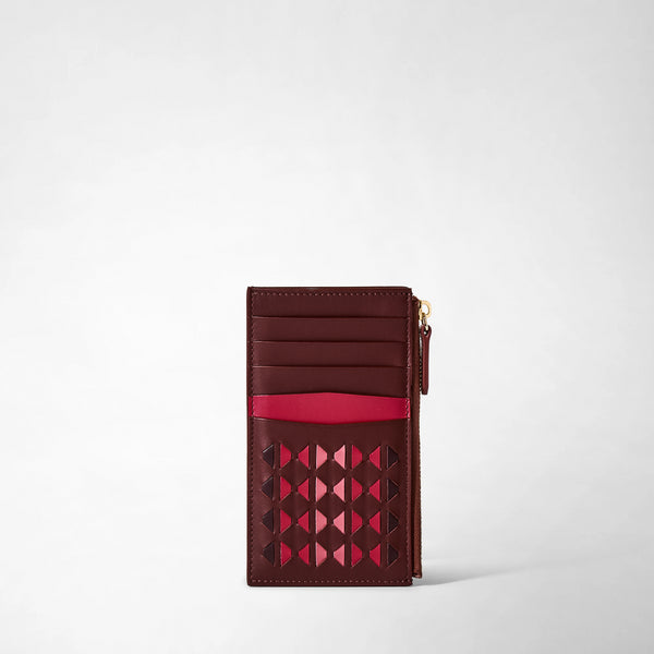 Frontal view: ZIP CARD CASE IN MOSAICO shows a slim, rosewood-colored leather card case with geometric pink mosaic weaving, card slots, and a zippered pocket on the right edge.