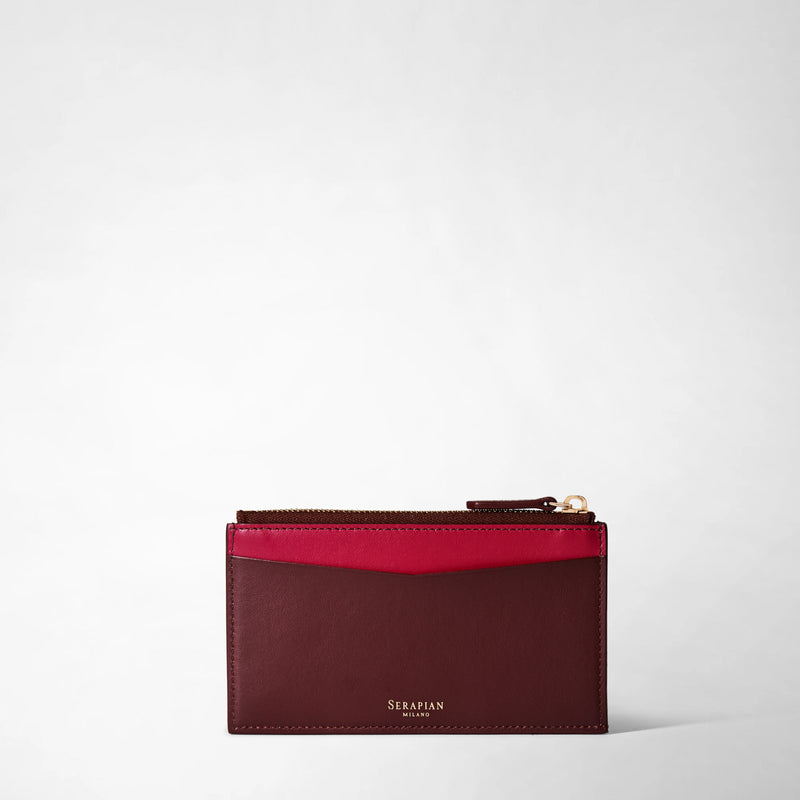 Frontal view: ZIP CARD CASE IN MOSAICO shows a slim rectangular rosewood leather card case with a red accent, gold zipper, and &#39;SERAPIAN MILANO&#39; text embossed at the bottom.