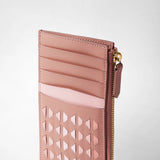 Detail view: ZIP CARD CASE IN MOSAICO displays a blush pink leather card case with multiple card slots, a gold zipper, and signature handwoven Mosaico pattern.