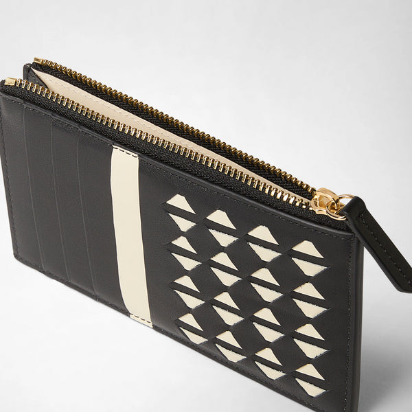 Detail view: ZIP CARD CASE IN MOSAICO features a slim black and off-white leather card case with a gold zipper, geometric woven pattern, multiple card slots, and contrasting hues.