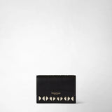 Frontal view: MINI TRI-FOLD WALLET IN MOSAICO features a compact black wallet with an off-white Mosaico woven pattern, and gold foil 'SERAPIAN MILANO' text on the flap.