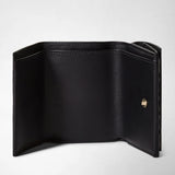 Frontal view: MINI TRI-FOLD WALLET IN MOSAICO shows the wallet opened, displaying black leather interior sections with a gold snap button and stitched edges.