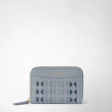 Front view: MINI ZIP WALLET IN MOSAICO stands upright, showing ice-blue leather with a geometric Mosaico pattern and a wraparound zipper. Visible lettering: “SERAPIAN MILANO”.