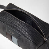 Detail view: WASHBAG IN STEPAN shows embossed asphalt-gray material, an open zippered compartment, and light blue leather accents. Visible markings: “SERAPIAN,” “MADE IN ITALY,” and “SERAPIAN MILANO.”