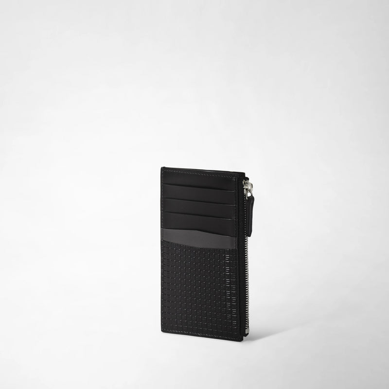 Frontal view: ZIP CARD CASE IN STEPAN displays a slim black card case with a textured Stepan canvas lower section, leather upper section, card slots, and a side zipper.
