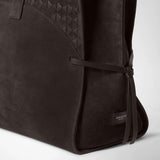 Detail view of the MAXI MARO BAG IN SUEDE AND MOSAICO featuring a geometric Mosaico pattern and side leather strips; the label reads “SERAPIAN MILANO”.